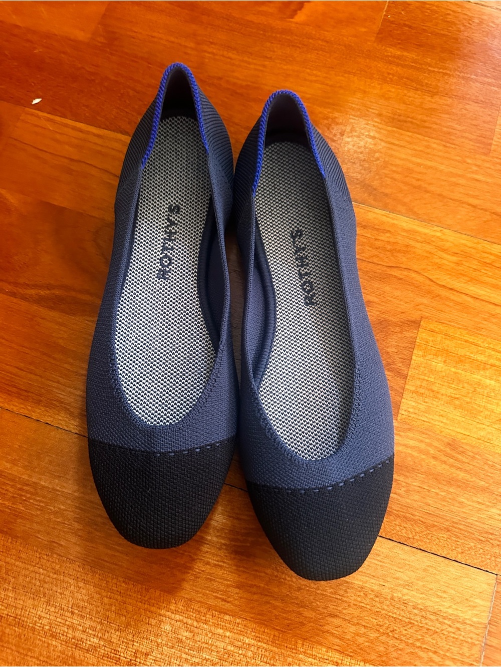 Rothy's Navy Slip-On Flats with Black Cap Toe